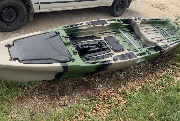 Green and tan fishing kayak